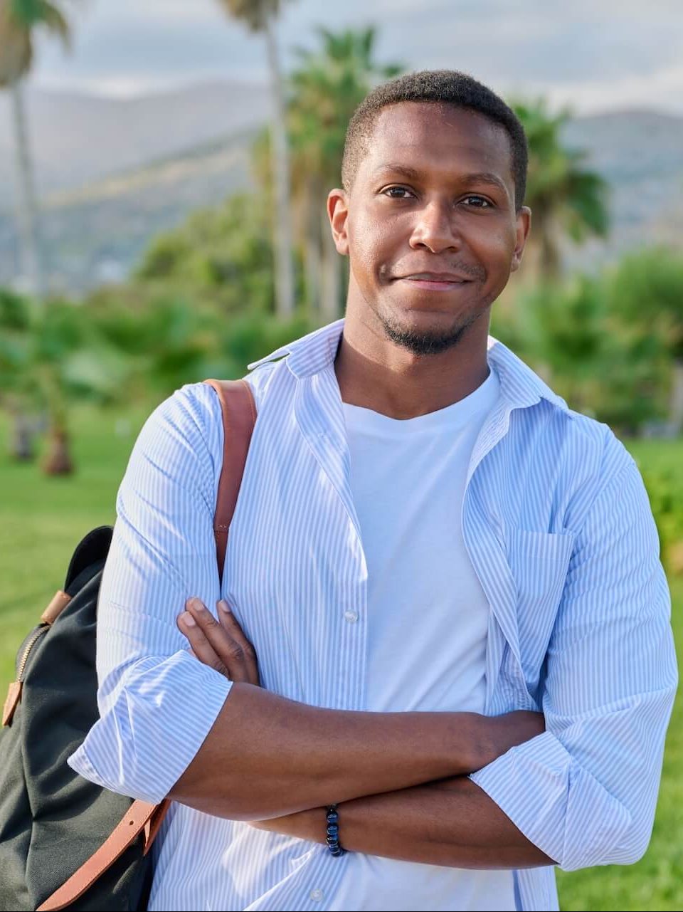 outdoor-portrait-of-african-american-man-with-cros-2022-03-29-23-50-50-utc-e1658645891809.jpg