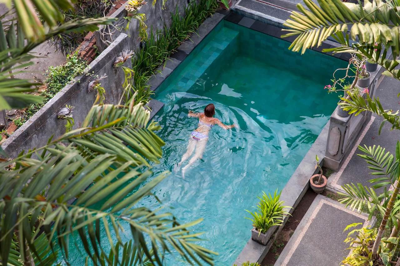 young-woman-swimming-in-the-pool-in-ubud-bali-vi-2022-07-11-03-48-14-utc-1.jpg